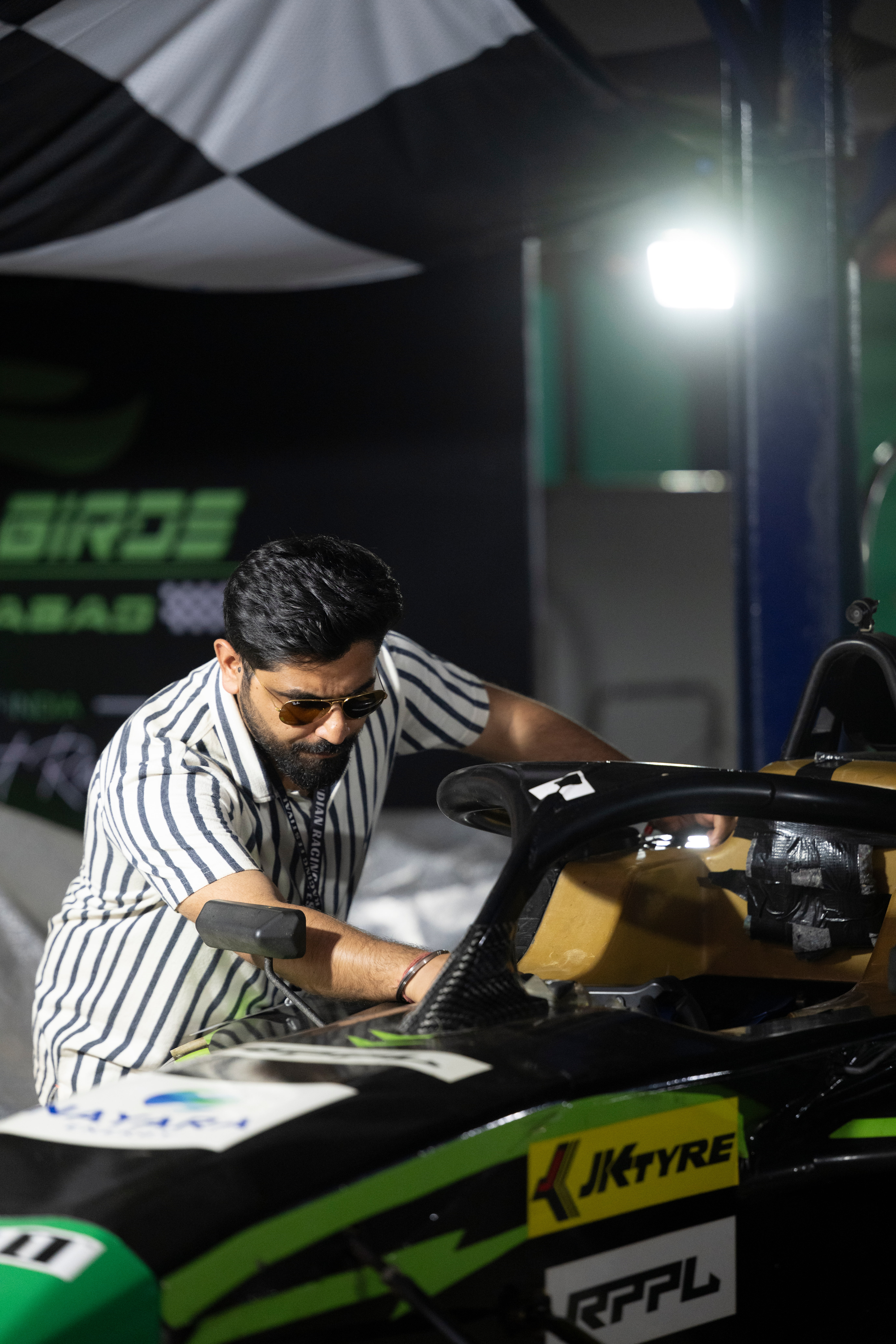 Racing team working on car